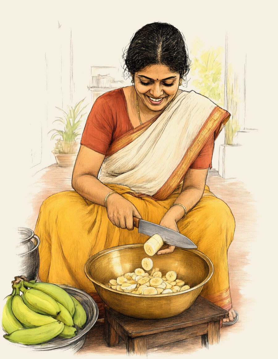 A woman in a saree slicing a peeled banana with a sharp knife, thin rounds falling into a brass vessel